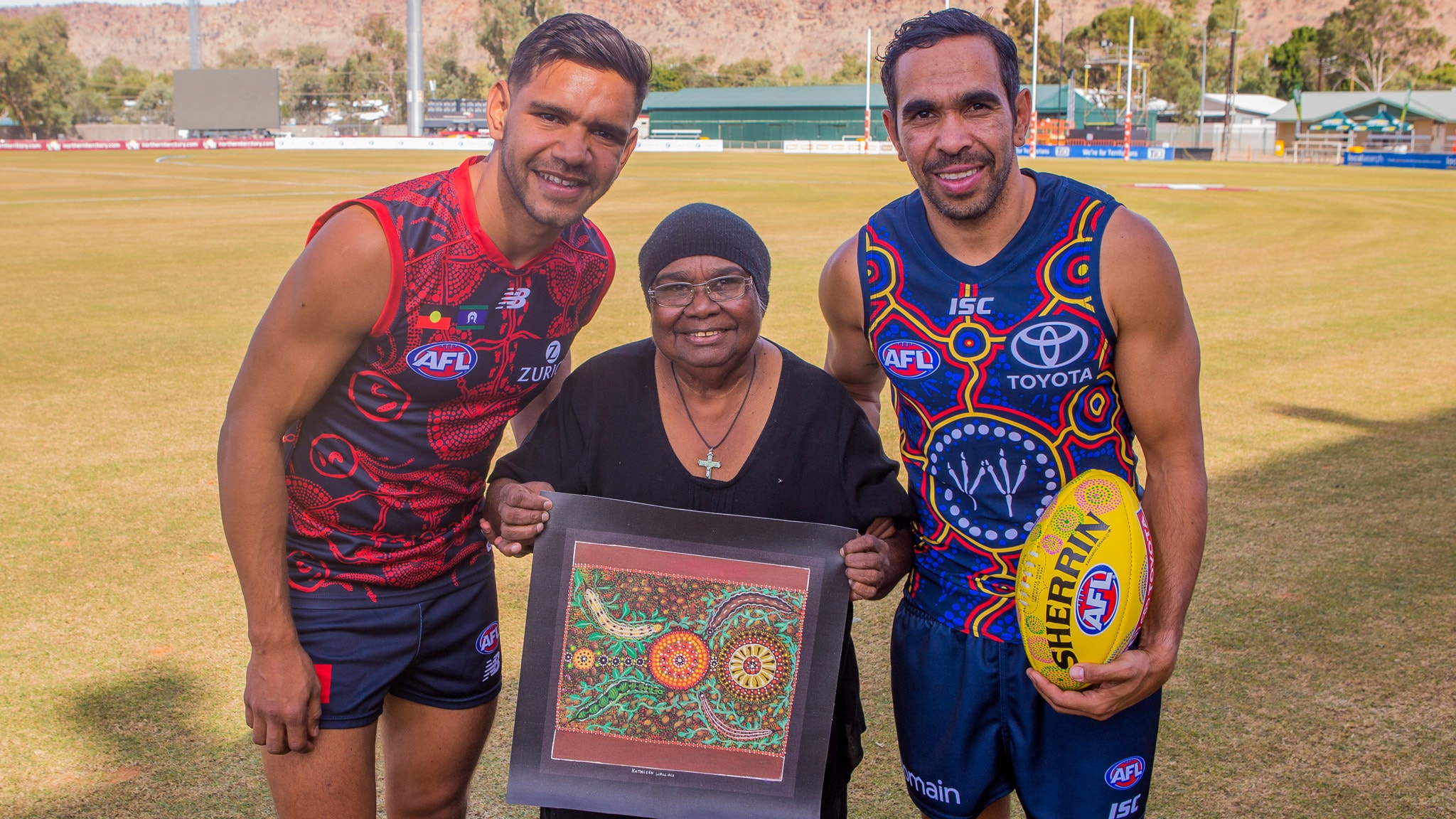 jettabettsart350.jpg Artist Kathleen Wallace with Melbourne's Neville Jetta and Adelaide's Eddie Betts. Picture: Charles Lowson - AFL,Indigenous